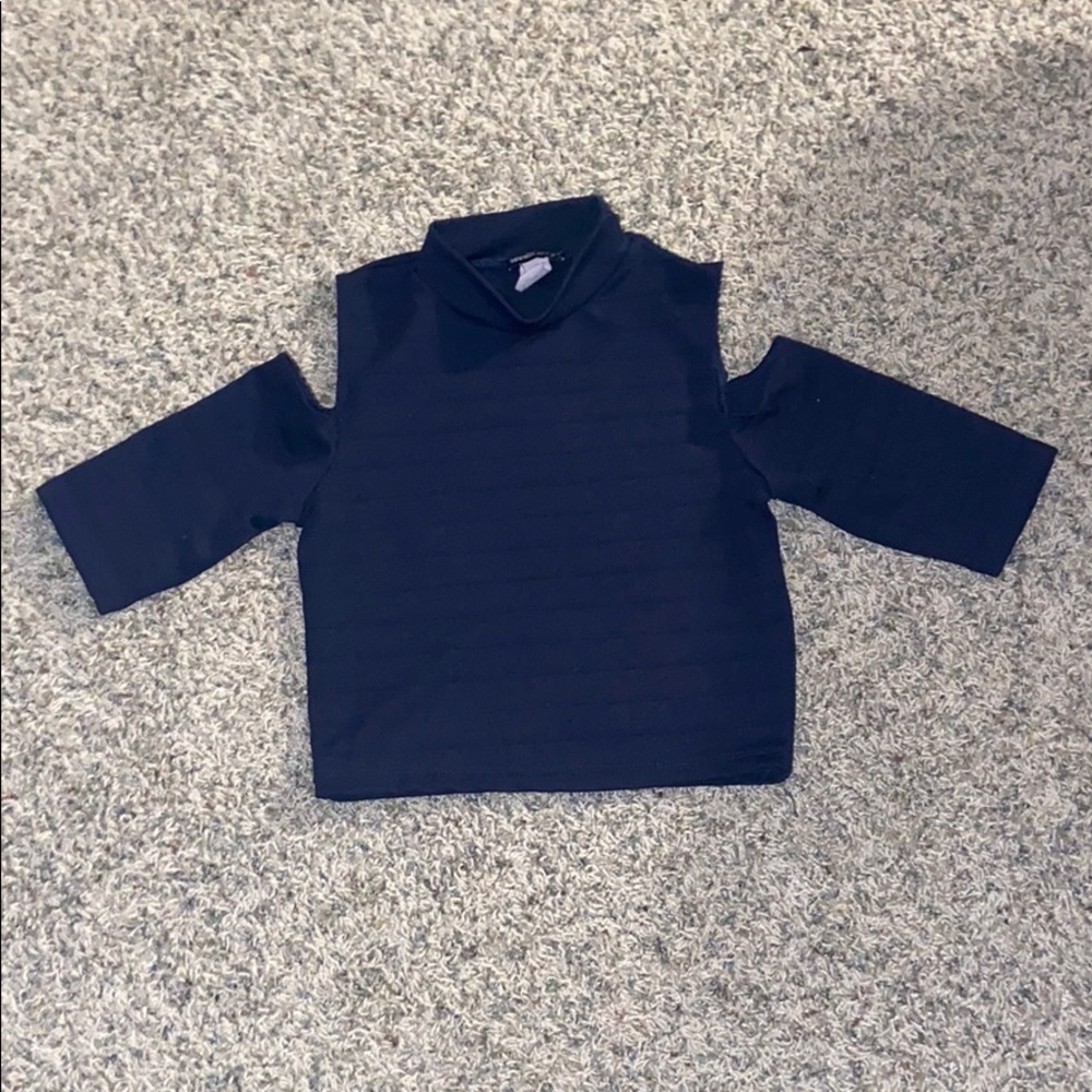 A Shoulder cut out turtle neck